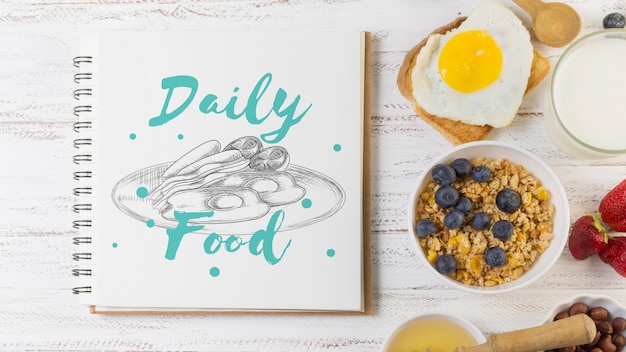 Notebook mockup with breakfast concept Free Psd