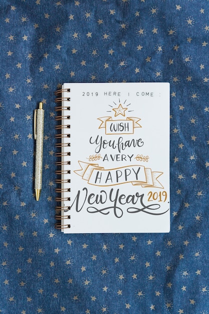 Download Free PSD | Notebook mockup with new year concept