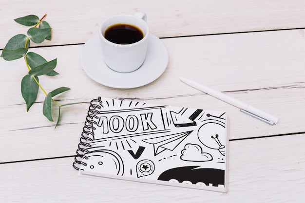 Notepad mockup with coffee PSD Template