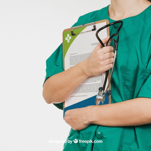 Nurse holding document and stethoscope PSD file | Free Download