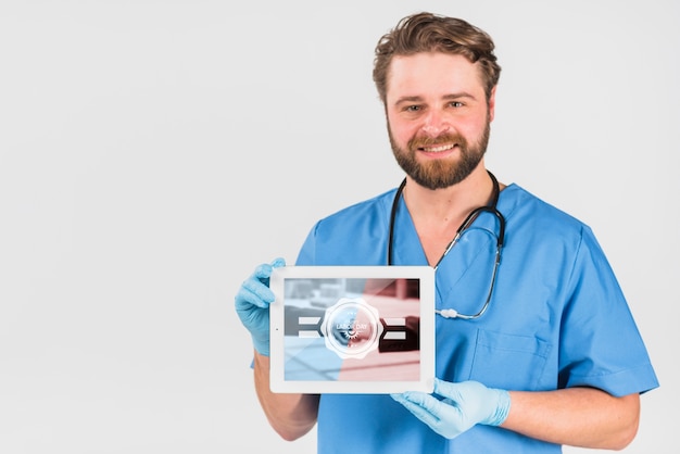 Download Nurse holding tablet mockup for labor day | Free PSD File