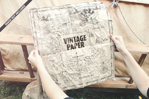 Download Premium PSD | Old paper in hands map poster concept mockup