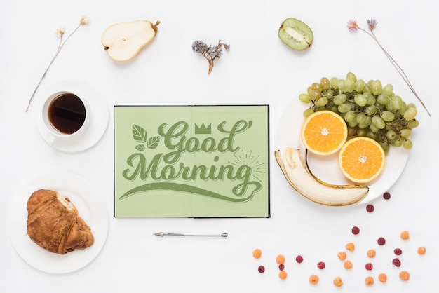 Free PSD | Open notebook mockup with breakfast concept