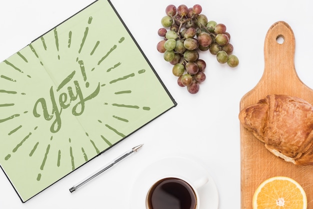 Download Open notebook mockup with breakfast concept | Free PSD File
