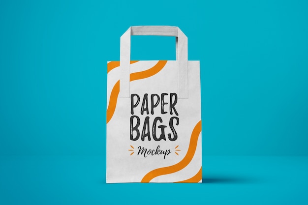 Download Paper bag on blue background mock up | Premium PSD File
