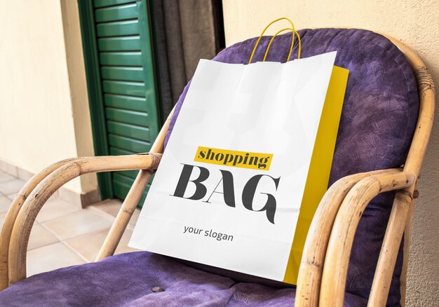 Download Paper shopping bag on the chair mockup | Premium PSD File