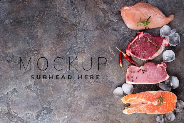 Download Premium Psd Raw Chicken Meat And Fish With Ice And Spices Mockup On Stone