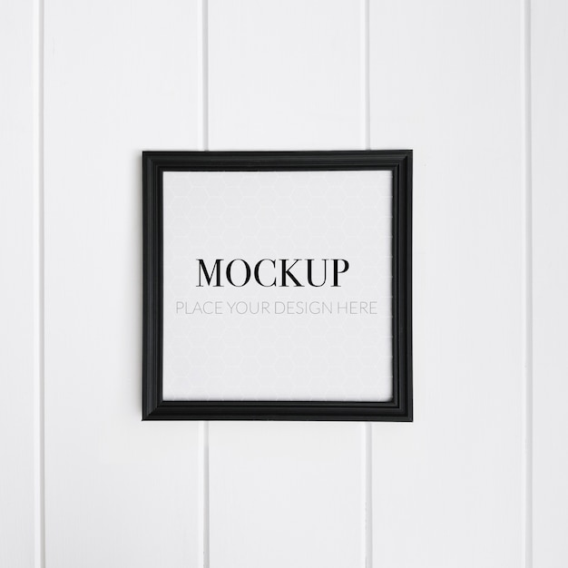 Free PSD | Realistic black frame on white wall for mockup