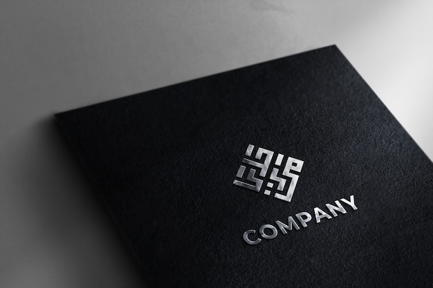 Download Premium PSD | Realistic silver logo mockup black paper texture background