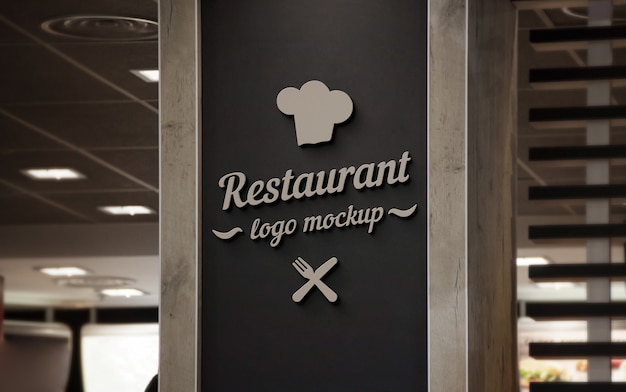 Download Premium PSD | Restaurant 3d logo mockup on black wall.