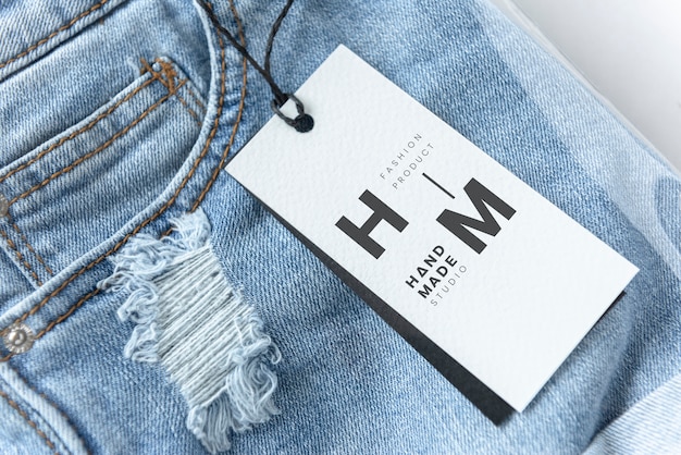 Ripped jean shorts with a tag mockup Free Psd