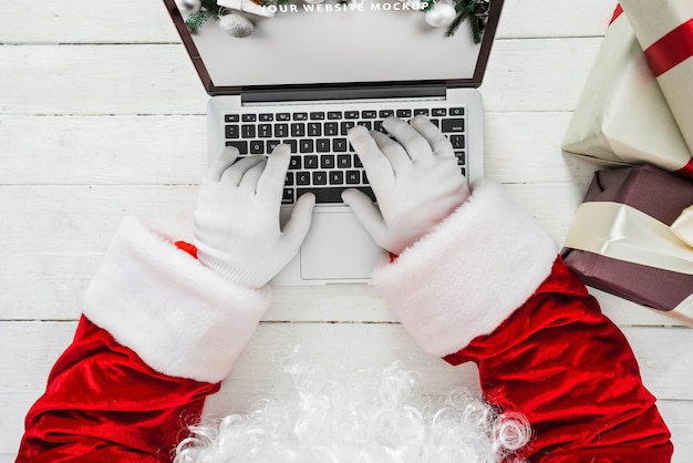 Free PSD | Santa typing on laptop