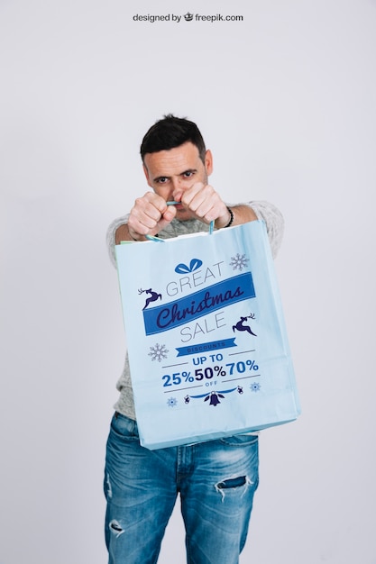 Download Shopping bag mockup with young man | Free PSD File