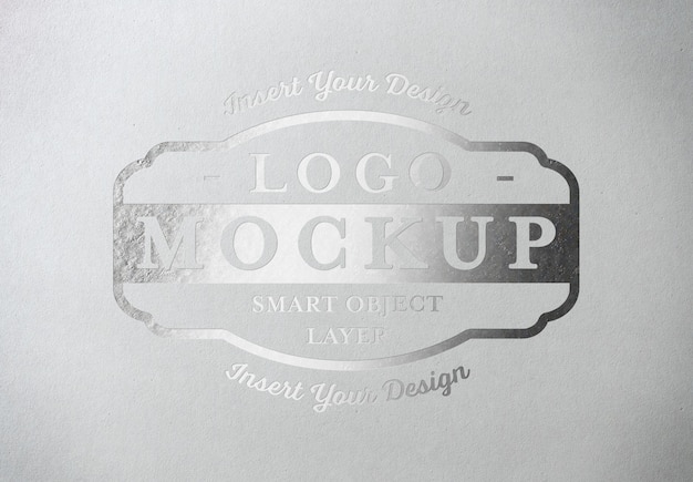 Download Premium PSD | Silver pressed logo mockup on white paper texture