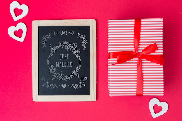 Download Slate mockup next to gift box for valentine | Free PSD File