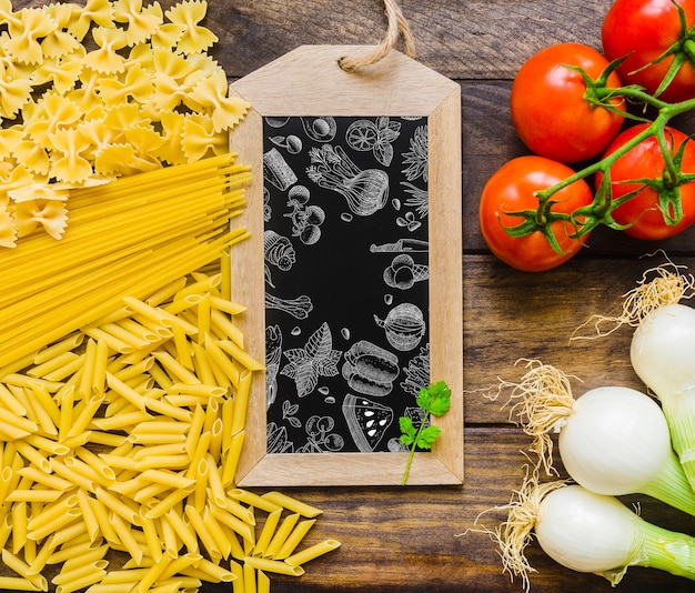 Download Slate mockup with pasta and vegetables concept | Free PSD File