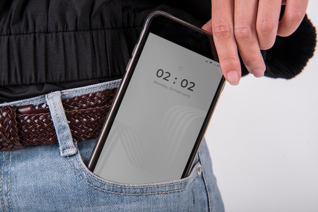 Download Smartphone mockup in the jeans pocket | Premium PSD File