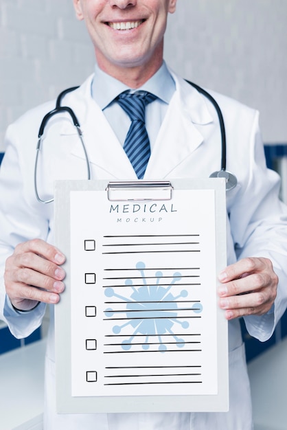 Download Free PSD | Smiley doctor holding a medical paper mock-up