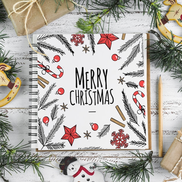 Download Spiral notebook mockup with christmas concept | Free PSD File