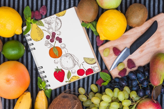 Download Spiral notebook mockup with fruits | Free PSD File PSD Mockup Templates