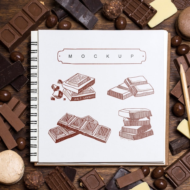 Square booklet mockup on chocolate background | Free PSD File