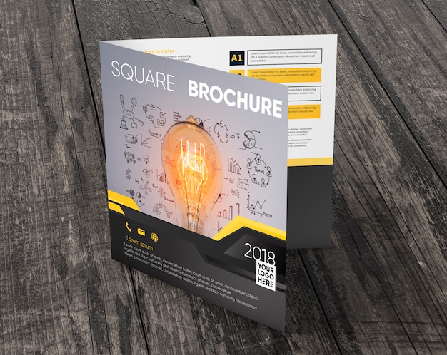 Download Free PSD | Square brochure mockup on wooden surface