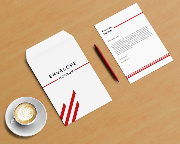Stationery concept with envelope mockup and coffee | Free PSD File