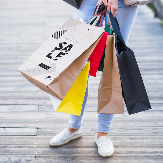 Download Stylish woman with shopping bags mockup | Free PSD File