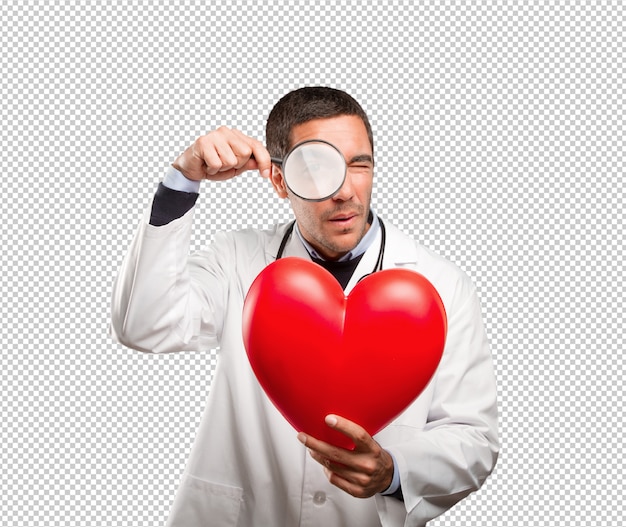 Download Surprised doctor using a magnifying glass against white background | Premium PSD File