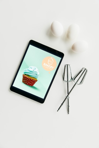 Download Tablet mockup with kitchen concept | Free PSD File