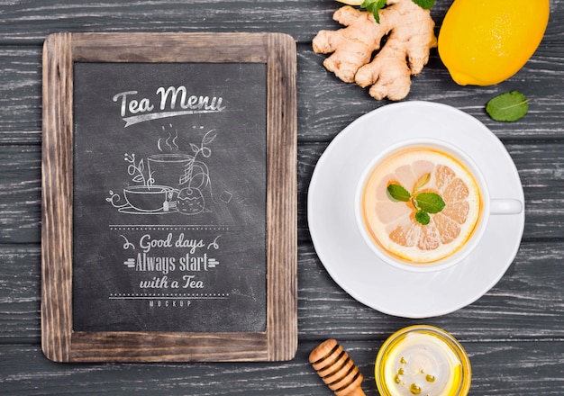 Download Tea concept on wooden table mock-up | Free PSD File