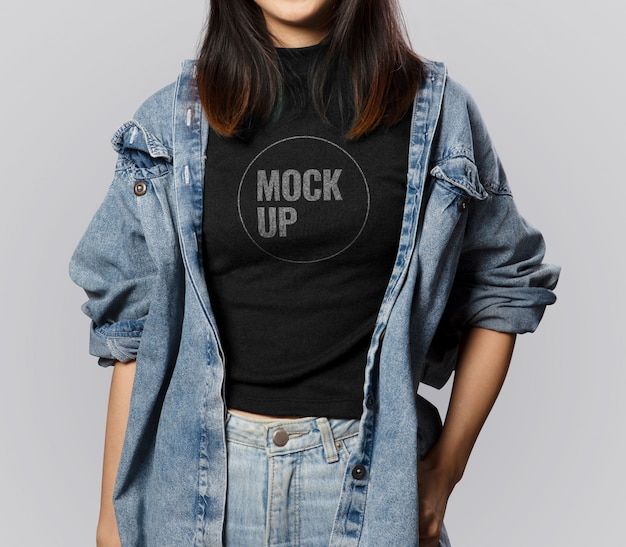 Download Teen girl wearing black t-shirt mockup and denim outfit ...