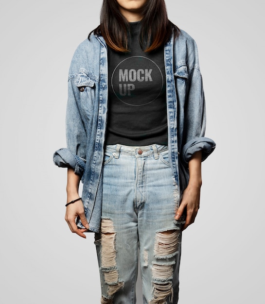 Download Teen girl wearing black t-shirt mockup and denim outfit ...