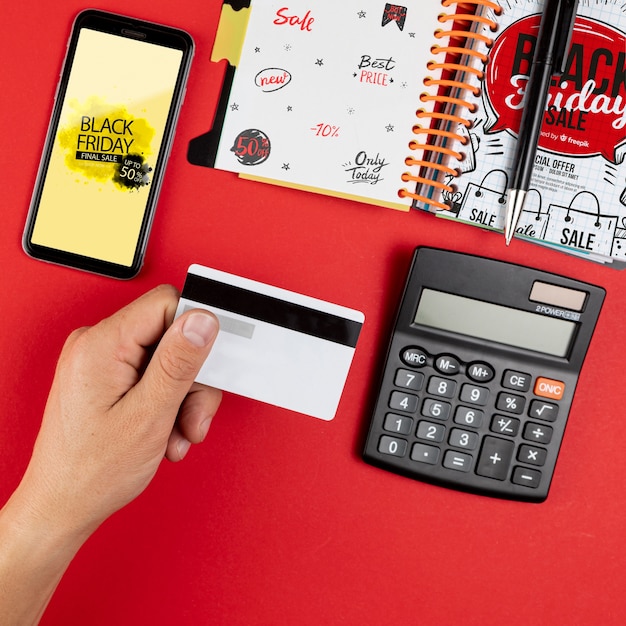 Top view black friday mock-up on red background Free Psd