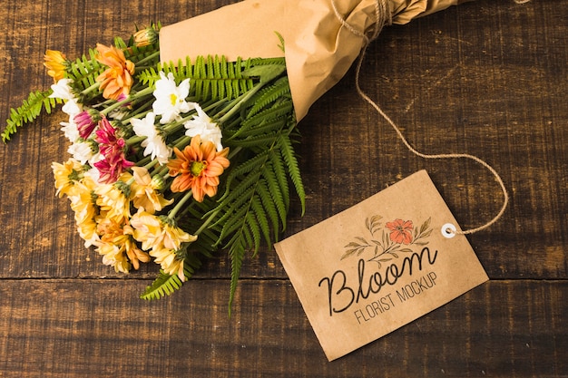 Download Top view bouquet of flowers with mock-up tag | Free PSD File
