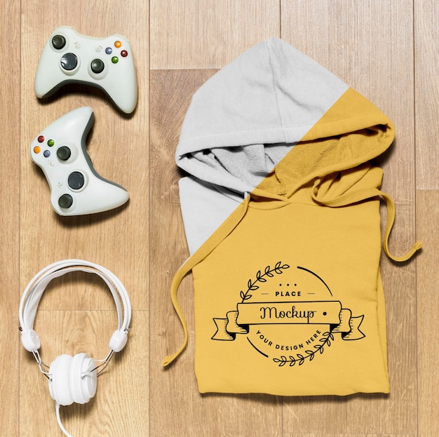 Top view folded hoodie mock-up with controllers and ...