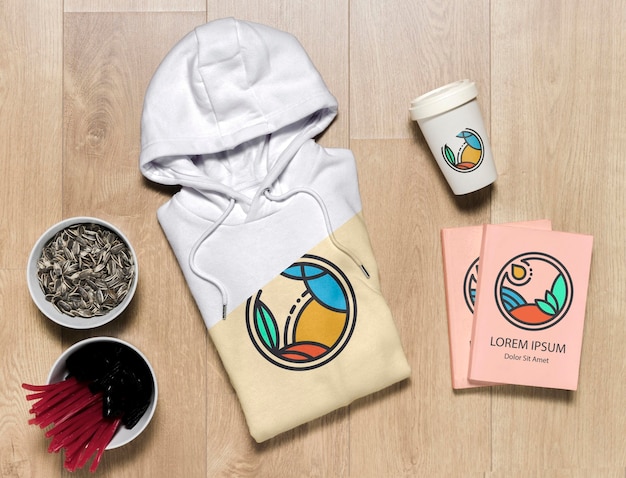 Download Top view folded hoodie mock-up with notebooks, cup and ...
