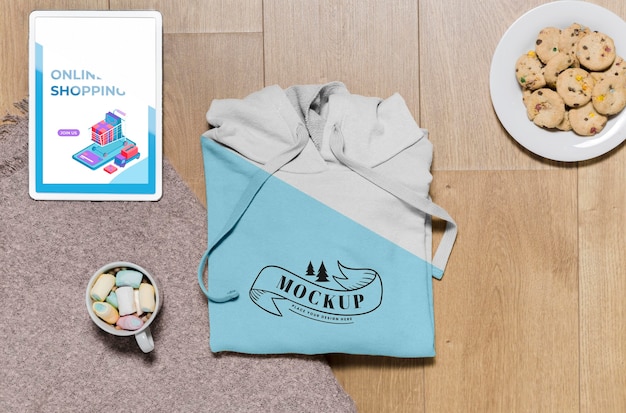 Download Top view folded hoodie mock-up with snacks | Free PSD File