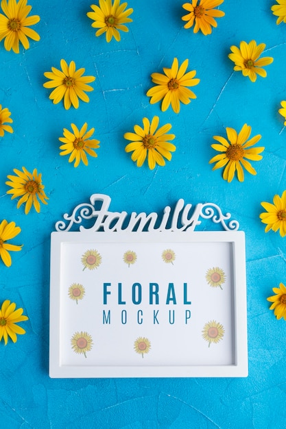 Download Premium PSD | Top view of frame mock-up with yellow chamomile