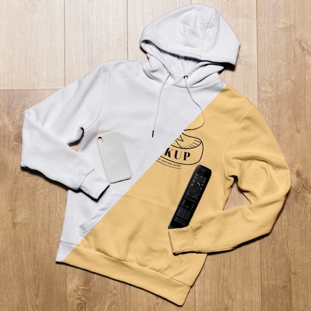 Download Top view hoodie mock-up with phone case and tv remote ...
