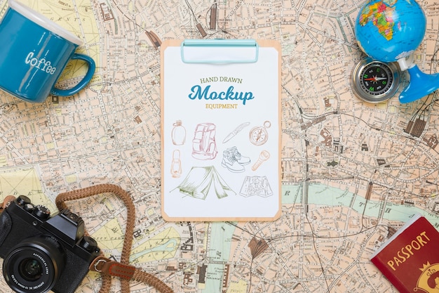 Download Free PSD | Top view of map with mock-up traveling essentials