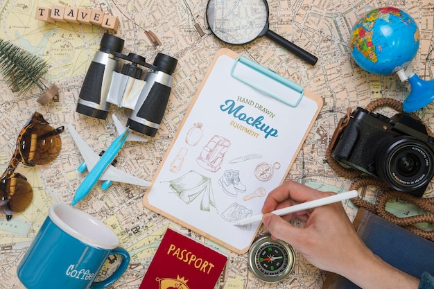 Download Free PSD | Top view of mock-up notepad with traveling essentials and camera
