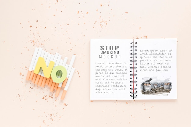 Download Free PSD | Top view notebook and cigarettes mock-up