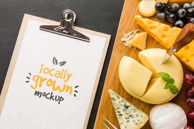 Download Free Psd Top View Of Notepad With Assortment Of Locally Grown Cheese Mock Up