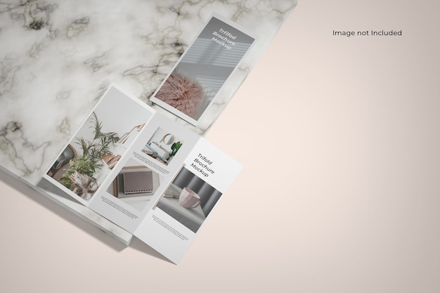 Premium PSD | Trifold brochure mockup near marble counter