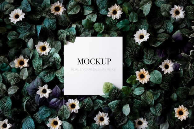 Download Free PSD | Tropical foliage background with daisies mockup