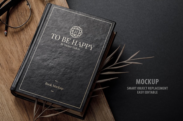 Vintage book cover mockup with dry leaves Premium Psd