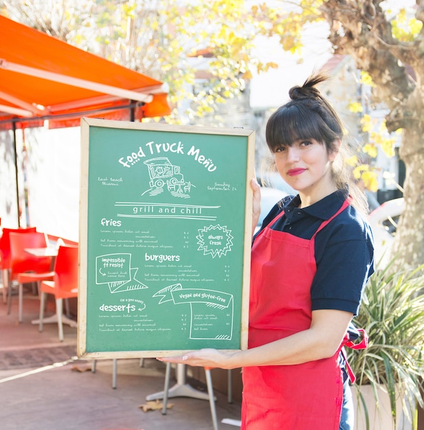 Download Free PSD | Waitress presenting board with menu