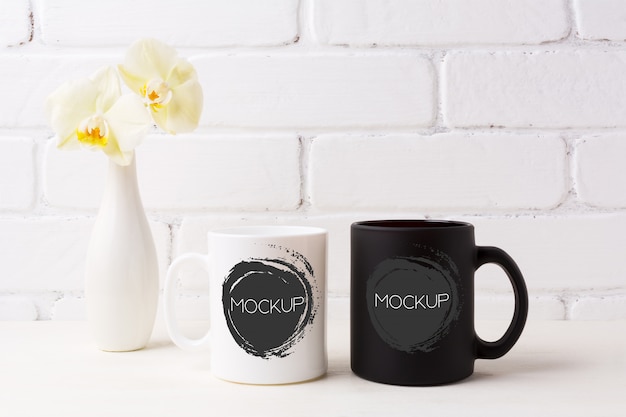Download White and black mug mockup with soft yellow orchid in vase ... PSD Mockup Templates