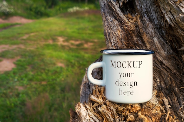 Download White campfire enamel mug mockup with tree stump | Premium ...